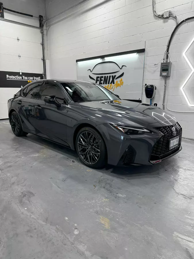 Ceramic window film installation on luxury car in Hamilton